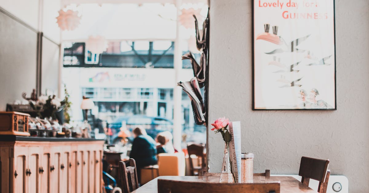 A charming café interior showcasing wooden furniture, warm lighting, and cozy atmosphere.