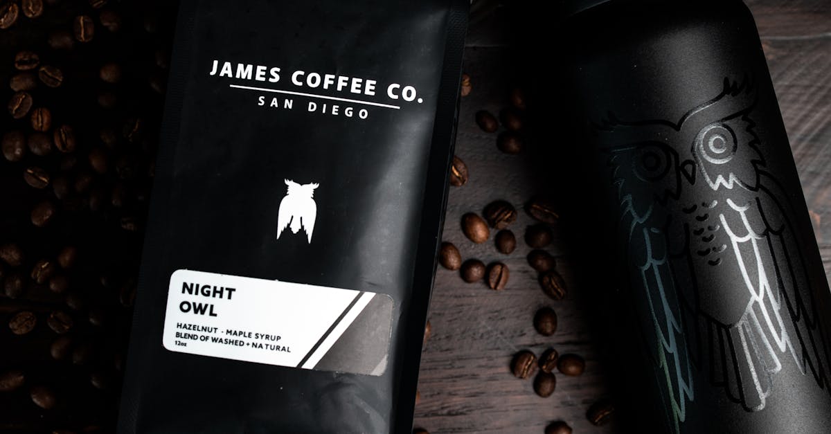 Top view of coffee beans with packaged coffee and refillable hot drink bottle